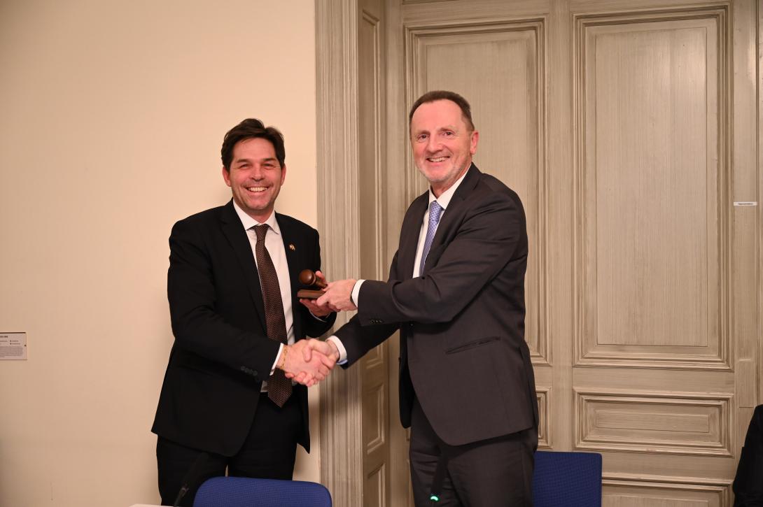 Henri Schumacher, Ambassador of Luxembourg, and Adrian Junker, Ambassador of Switzerland, and passing the Chairship of the Council from Luxembourg to Switzerland.